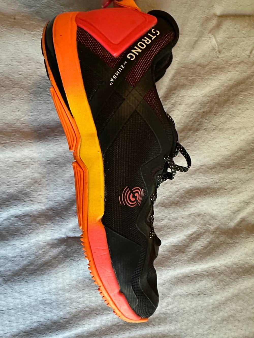 Black women’s ZUMBA Trainer with Orange Gradient Sole
